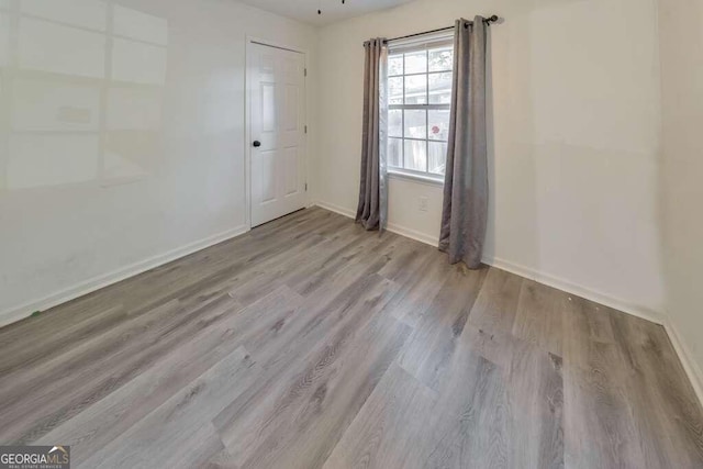 83 Sunset Ln, Newnan, GA 30263 - unfurnished room featuring wood finished floors and baseboards