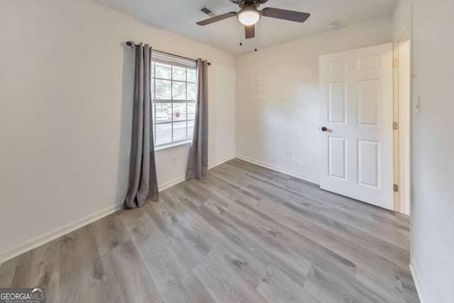 83 Sunset Ln, Newnan, GA 30263 - unfurnished room with visible vents, baseboards, wood finished floors, and ceiling fan