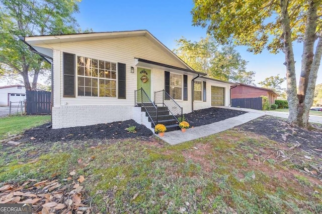 83 Sunset Ln, Newnan, GA 30263 - bungalow-style home with an attached garage, aphalt driveway, and fence