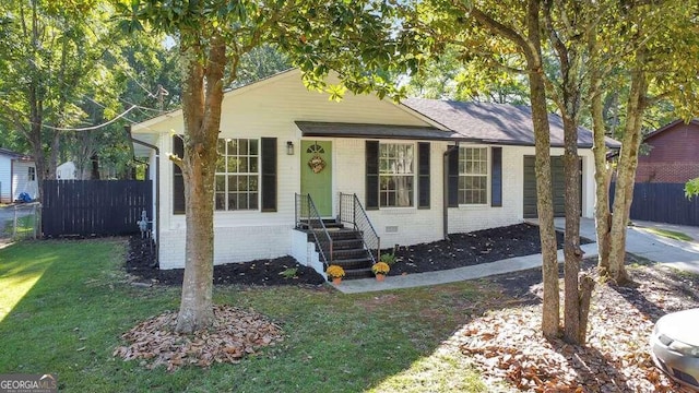 83 Sunset Ln, Newnan, GA 30263 - bungalow featuring driveway, crawl space, a front lawn, an attached garage, and fence