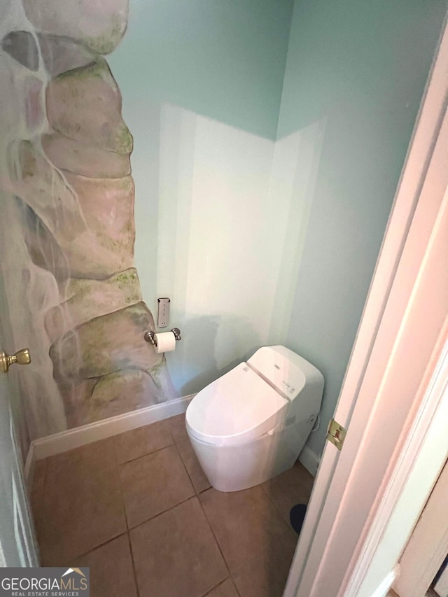 bathroom with tile patterned floors and toilet