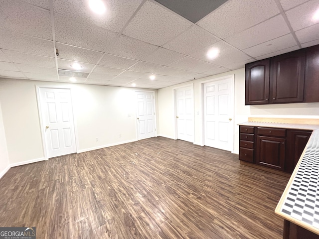 basement featuring dark hardwood / wood-style flooring