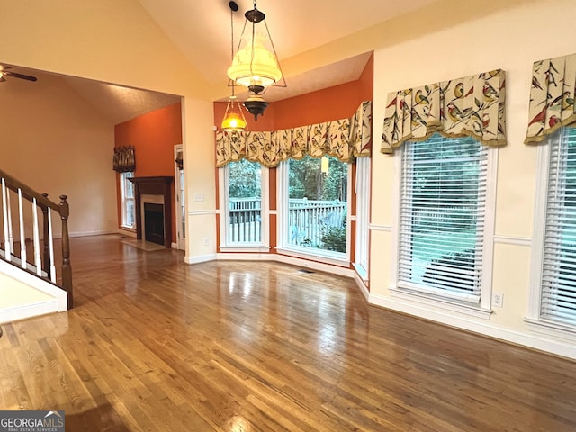 interior space featuring ceiling fan, vaulted ceiling, and hardwood / wood-style floors