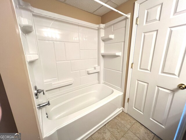 bathroom with bathing tub / shower combination