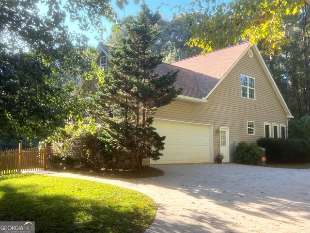 view of side of property with a garage