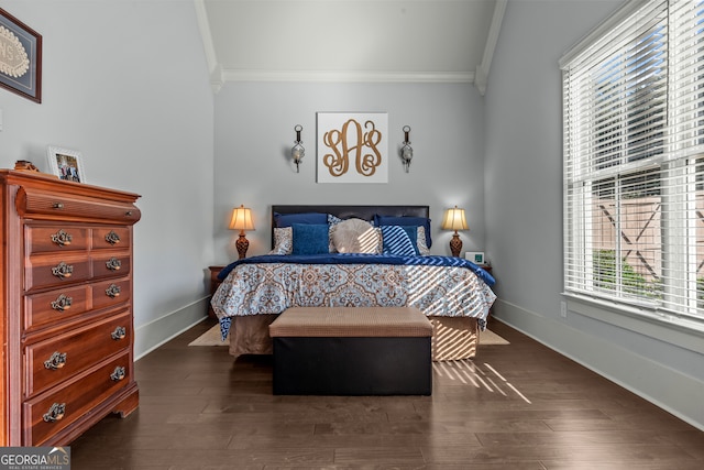 bedroom featuring ornamental molding and dark wood-type flooring