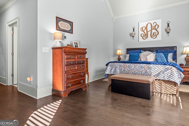 bedroom with crown molding and dark hardwood / wood-style flooring