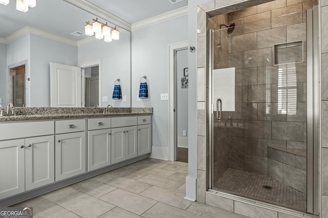 bathroom featuring vanity, crown molding, an enclosed shower, and tile patterned floors