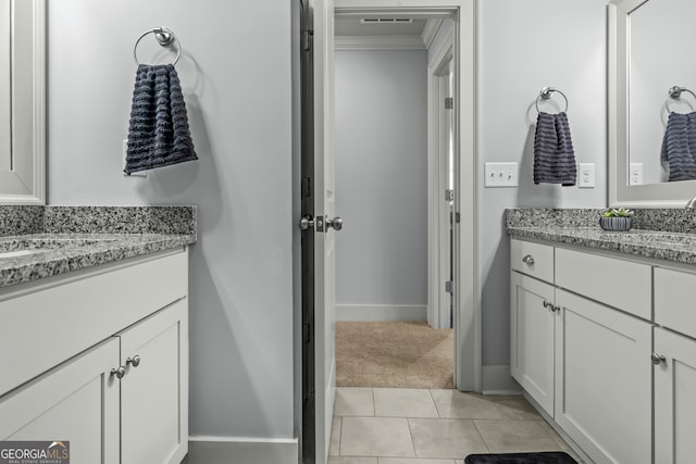 bathroom with ornamental molding, tile patterned flooring, and vanity