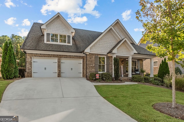 craftsman-style home with a front lawn and a garage