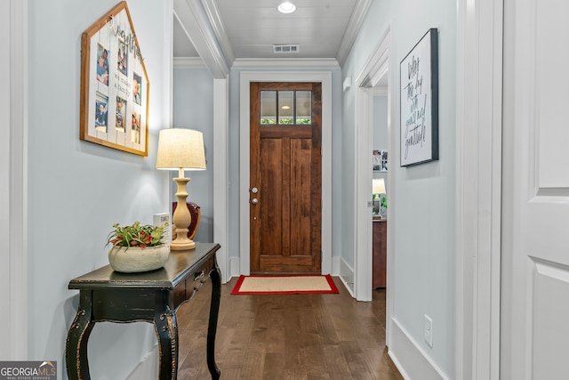 foyer entrance featuring dark hardwood / wood-style floors and ornamental molding