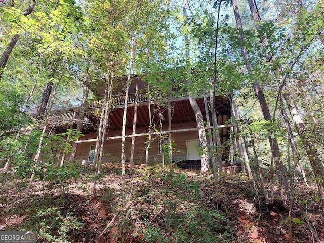 view of home's exterior with a wooden deck