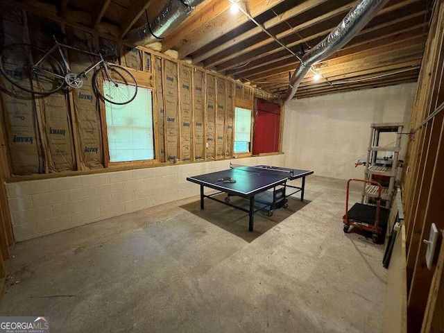 recreation room with concrete flooring