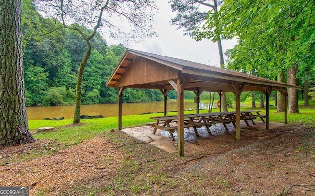 view of home's community featuring a gazebo, a lawn, and a water view