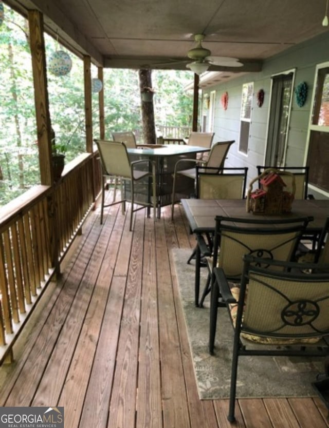 wooden deck with ceiling fan