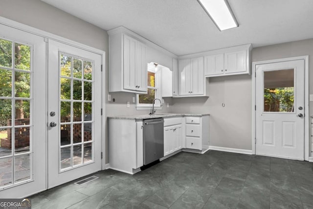 kitchen featuring french doors, white cabinetry, sink, and dishwasher