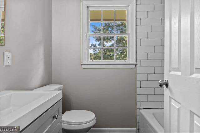 bathroom featuring vanity and toilet