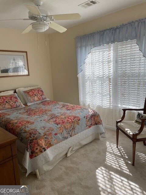 carpeted bedroom with ceiling fan