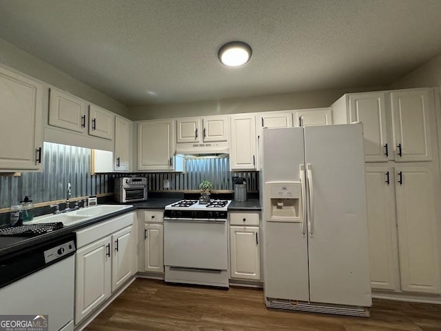 kitchen featuring white cabinetry, white appliances, sink, and dark wood-type flooring