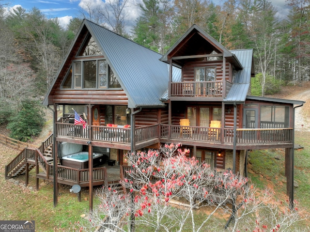 rear view of property featuring a sunroom