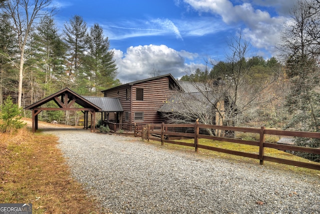 view of side of property with a carport