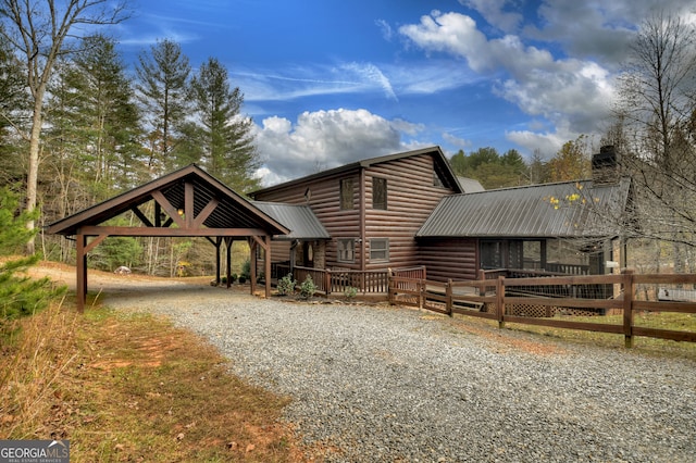 log-style house featuring a deck