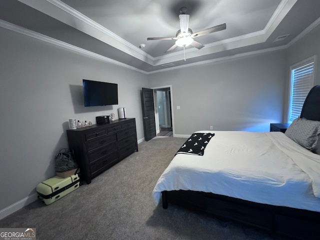 bedroom with ornamental molding, carpet flooring, a raised ceiling, and ceiling fan