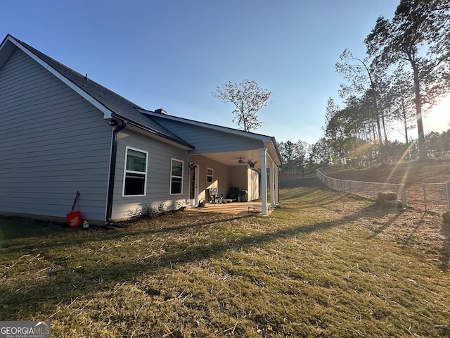 view of yard featuring a patio area and ceiling fan