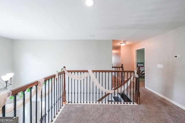 hallway with carpet flooring