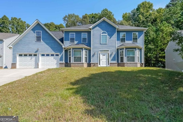 view of front of property with a front yard and a garage