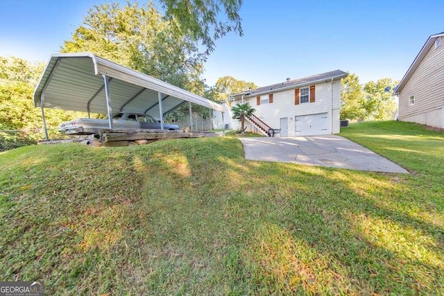 rear view of house with a garage and a lawn