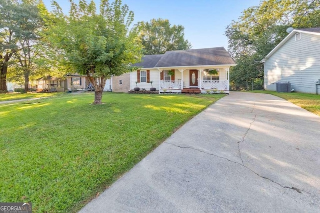 ranch-style home with a front yard and a porch