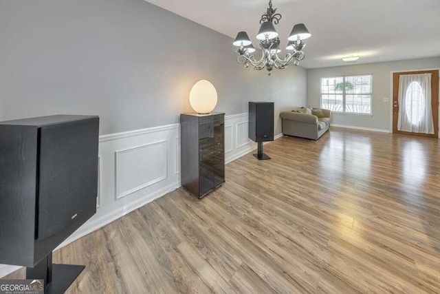 dining room featuring an inviting chandelier and light hardwood / wood-style flooring