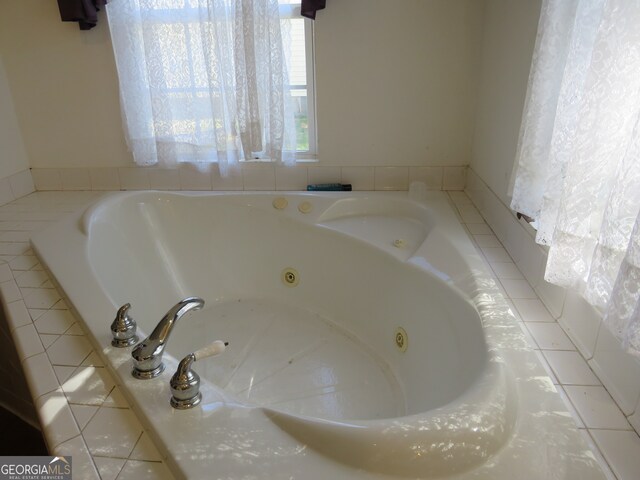 bathroom with tiled tub