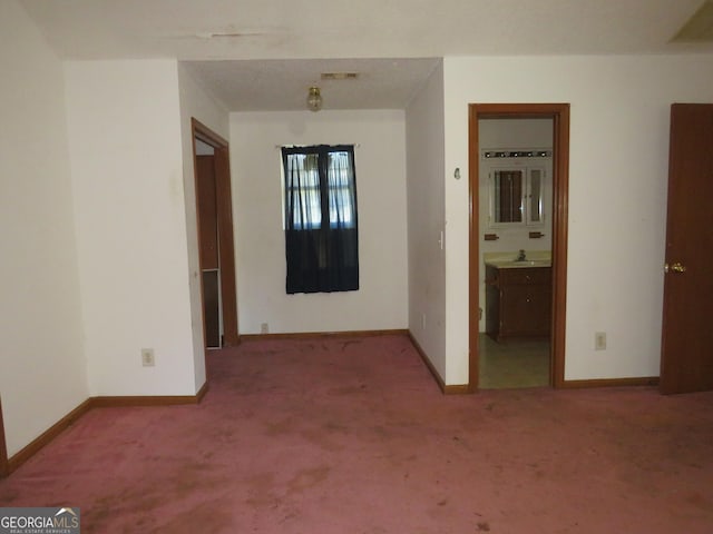 402 Thurman Rd, Stockbridge, GA 30281 - corridor with carpet, baseboards, and a sink