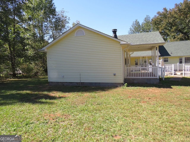 402 Thurman Rd, Stockbridge, GA 30281 - back of house with a lawn, a porch, and a shingled roof