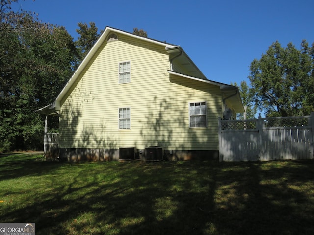 402 Thurman Rd, Stockbridge, GA 30281 - view of side of home with a lawn and central air condition unit