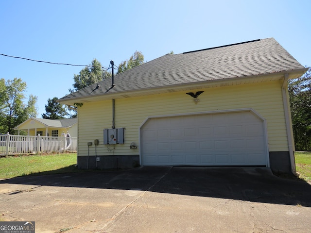 402 Thurman Rd, Stockbridge, GA 30281 - view of home's exterior with a garage and a shingled roof