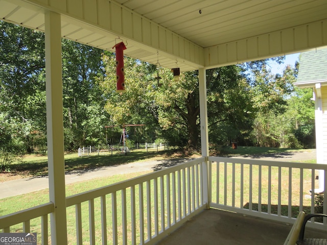 402 Thurman Rd, Stockbridge, GA 30281 - porch with a lawn and view of wooded area