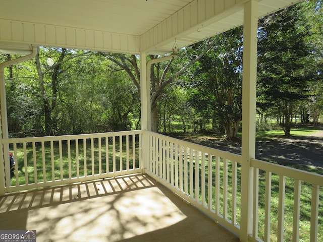 402 Thurman Rd, Stockbridge, GA 30281 - covered porch with view of scattered trees