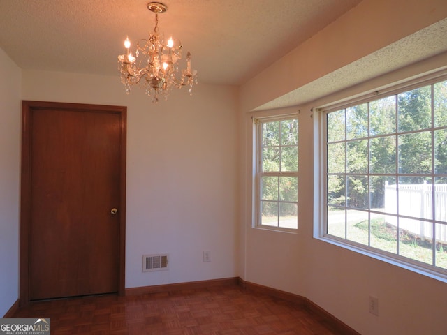 402 Thurman Rd, Stockbridge, GA 30281 - spare room featuring a chandelier and baseboards