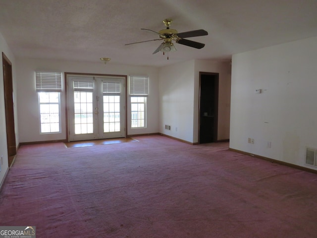 402 Thurman Rd, Stockbridge, GA 30281 - spare room with baseboards, ceiling fan, light colored carpet, and french doors