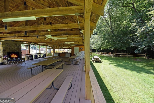 wooden terrace with a lawn