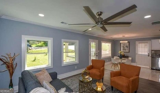 interior space with ceiling fan, crown molding, and wood-type flooring