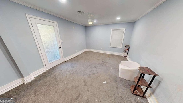 carpeted spare room featuring ornamental molding