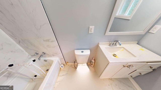 bathroom featuring toilet, vanity, a washtub, and a skylight