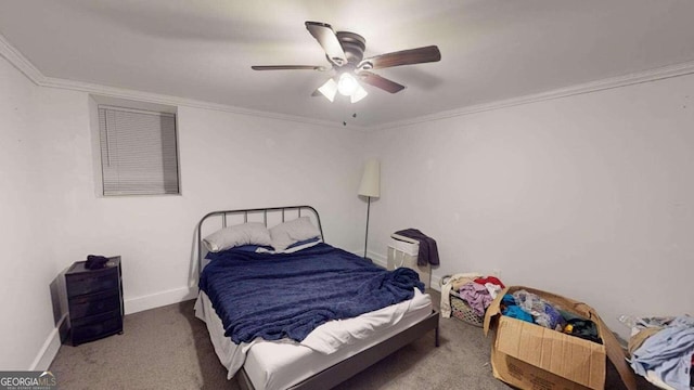 carpeted bedroom with ornamental molding and ceiling fan