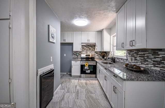 kitchen featuring dark stone countertops, sink, white cabinetry, stainless steel range, and a textured ceiling