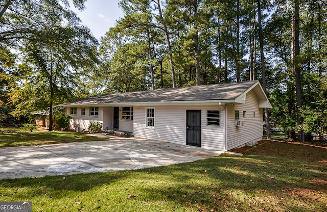 single story home with a front lawn and a patio