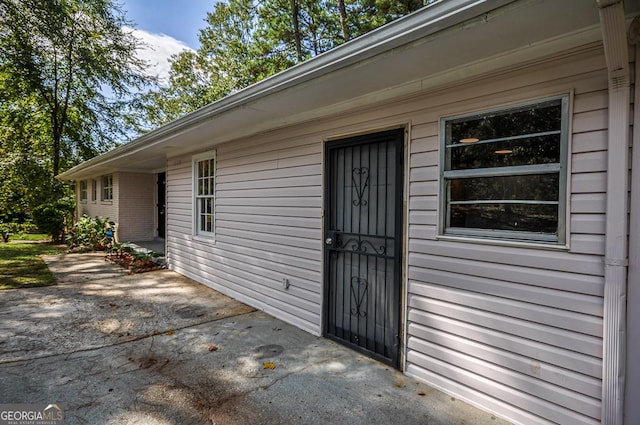 property entrance with a patio area